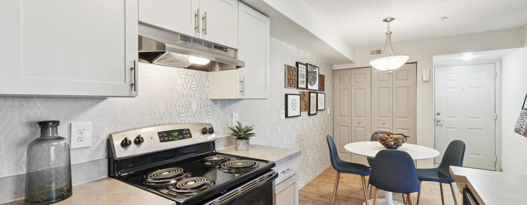 a kitchen with white cabinets