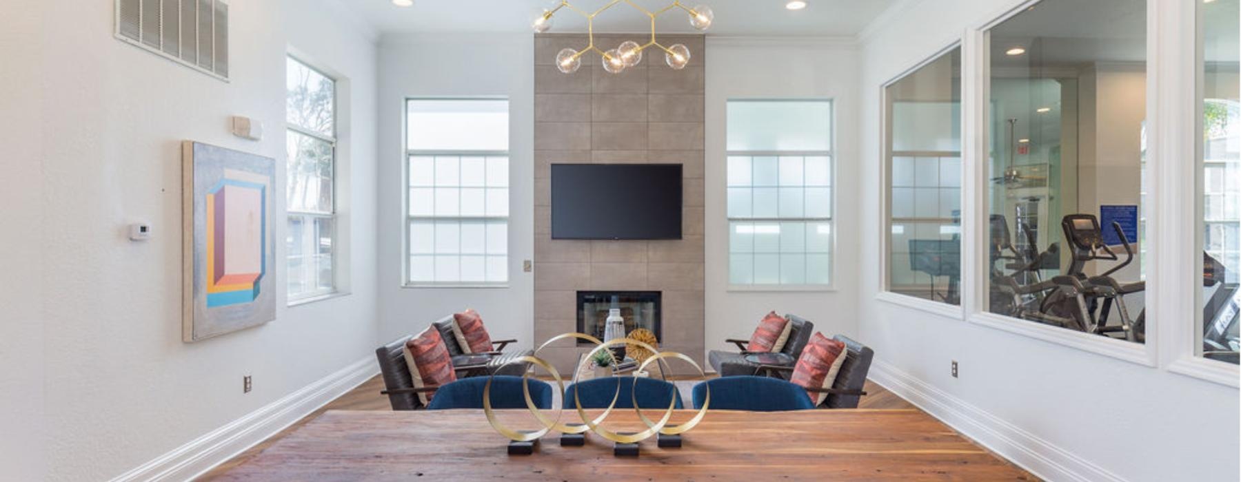 a living room with a table and chairs