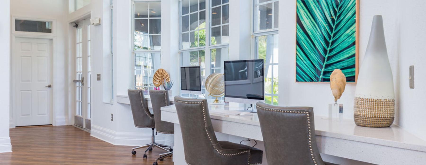 a room with a table chairs and a tv